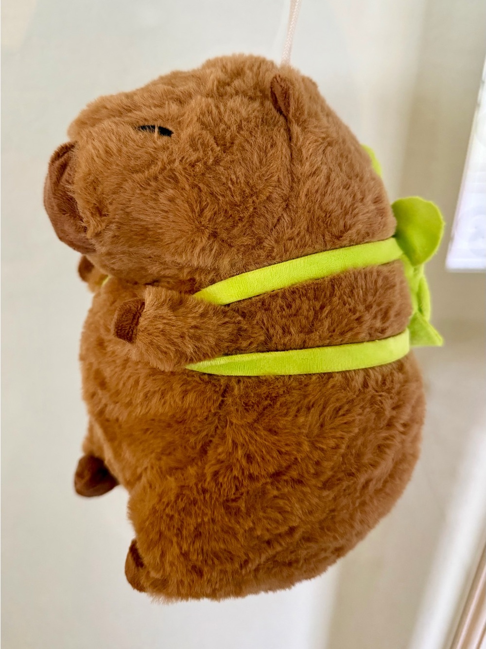 Plush Brown capybara with turtle backpack.